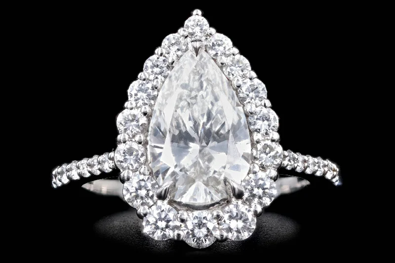 Platinum 2.10 Carat Pear Cut Diamond Graduated Halo Engagement Ring GIA Certified