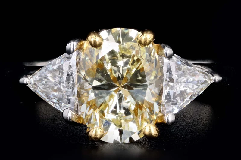 Platinum and 22K Yellow Gold 1.76 Carat Oval Cut Fancy Yellow Diamond Engagement Ring